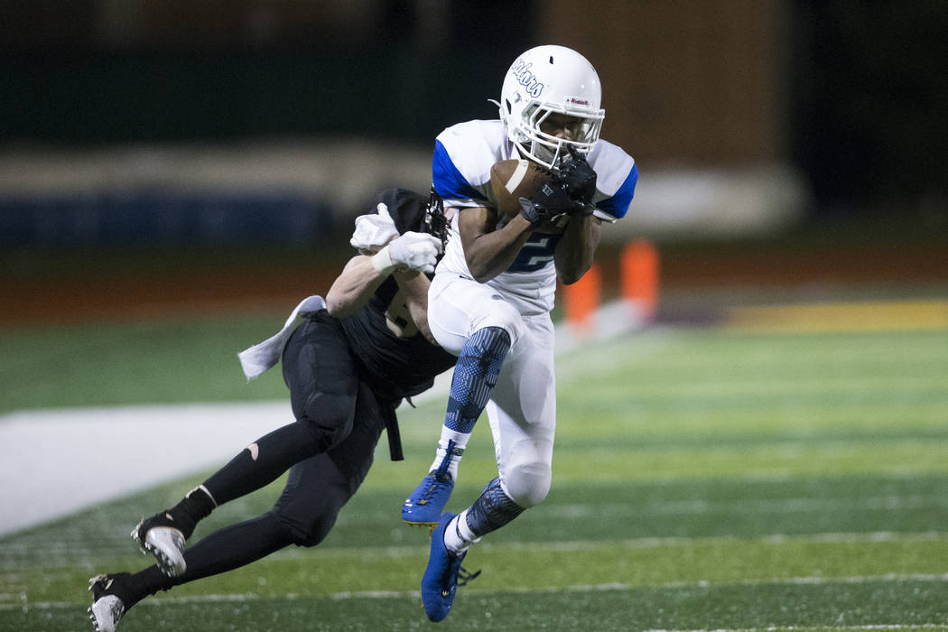 Green Valley’s Israel Robinson (12) intercepts the ball against Faith Lutheran in the ...