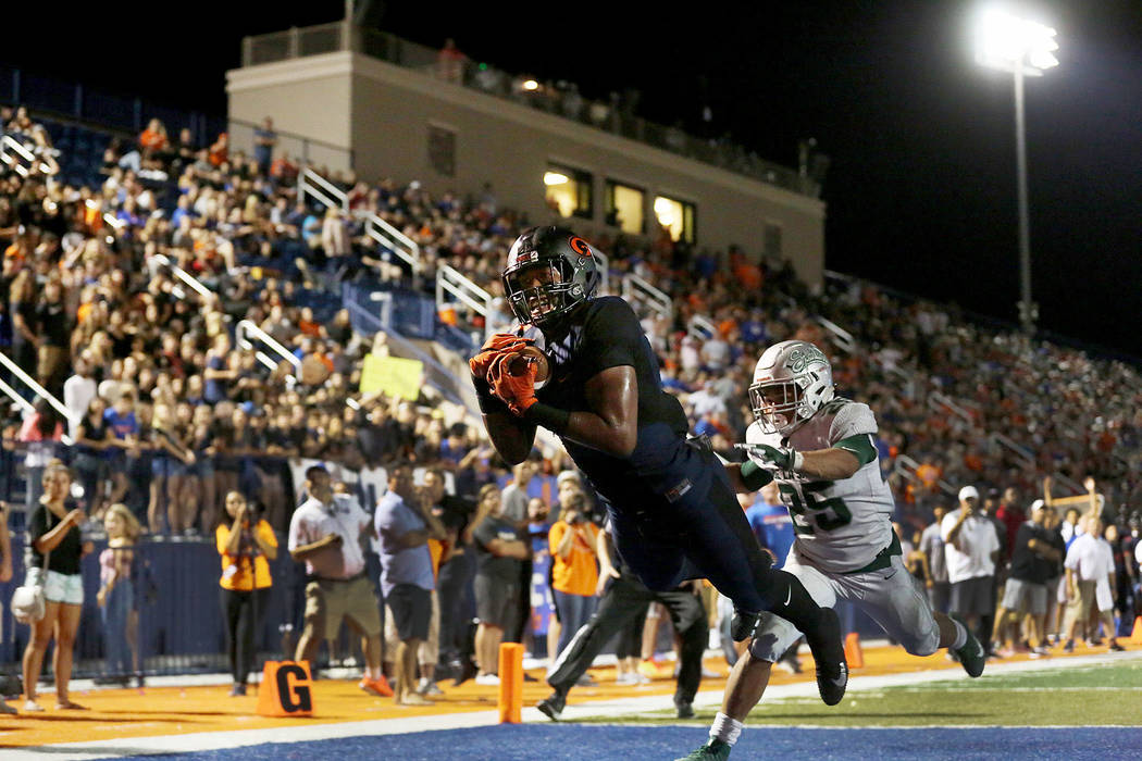 Bishop Gorman’s Brevin Jordan dives into the end zone for a touchdown as De La Salle p ...