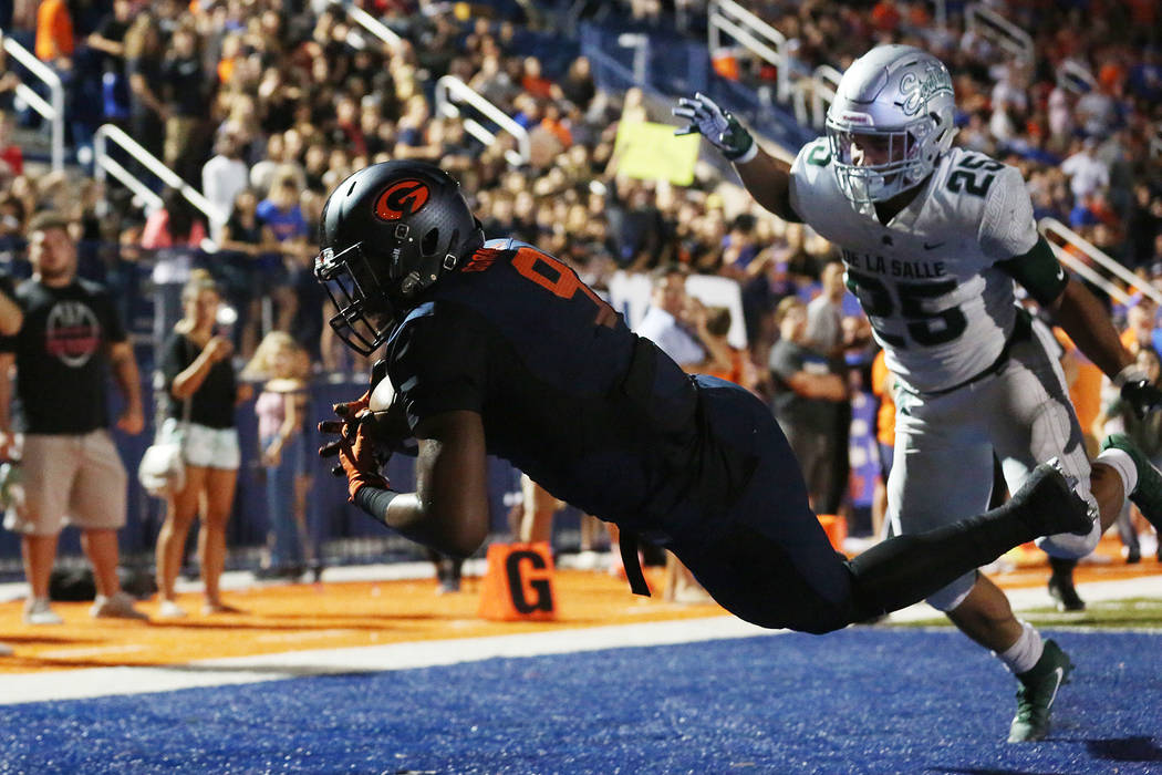 Bishop Gorman’s Brevin Jordan (9) dives into the end zone with the ball for a touchdow ...