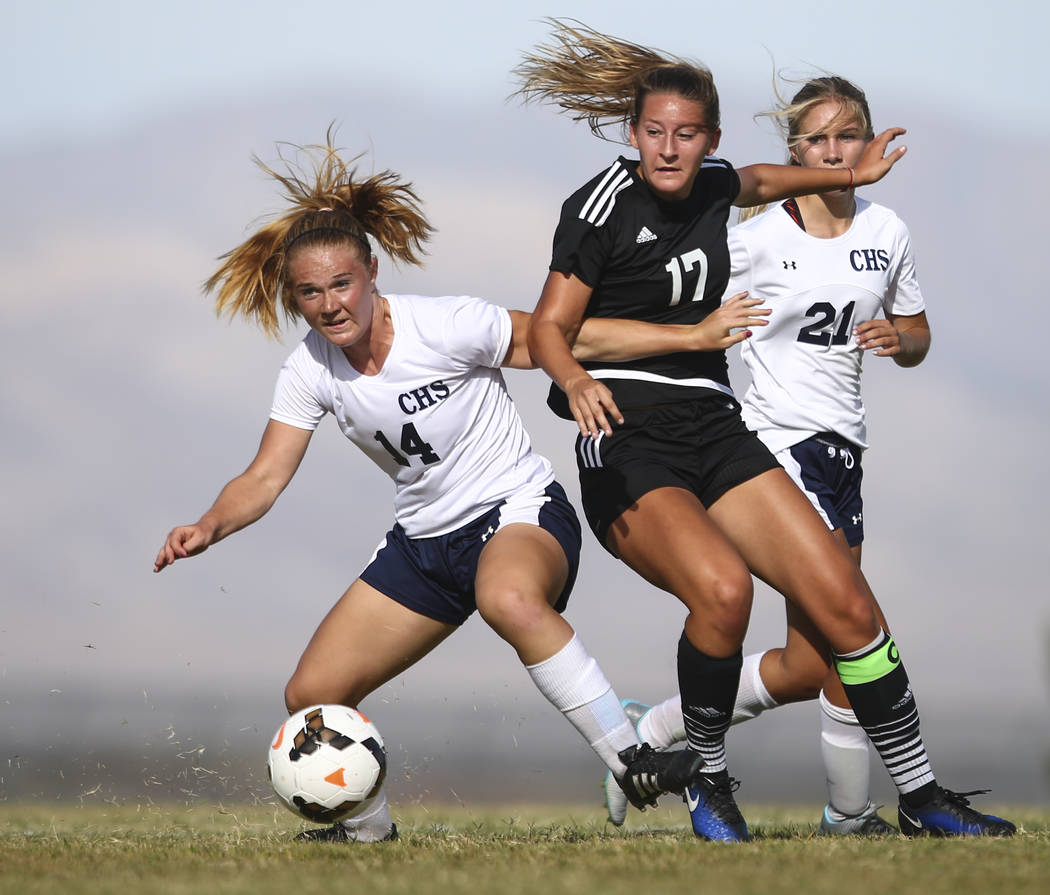 Centennial’s Dawn Madison Frederick (14) goes after the ball against Palo Verde’ ...