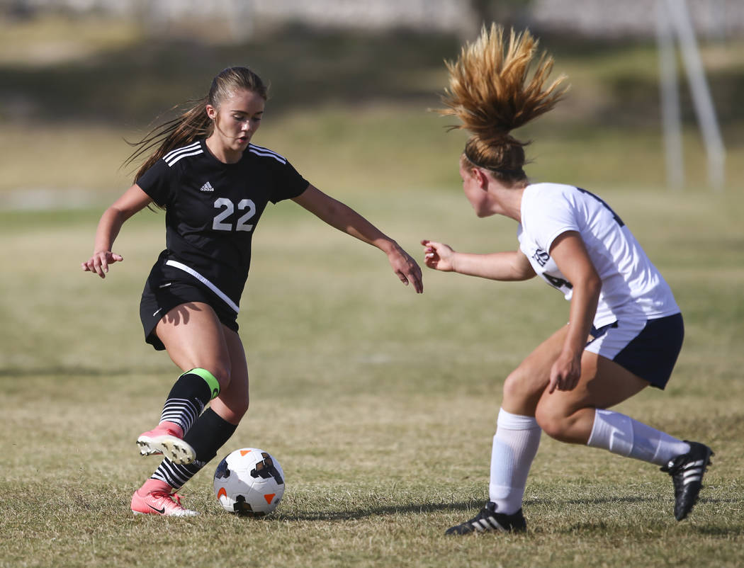 Centennial’s Dawn Madison Frederick, right, defends against Palo Verde’s Sloan N ...