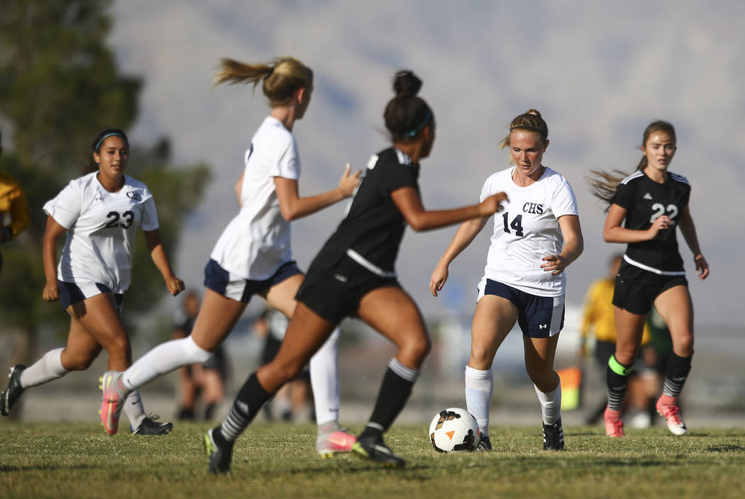 Centennial’s Dawn Madison Frederick (14) moves the ball against Palo Verde during a so ...