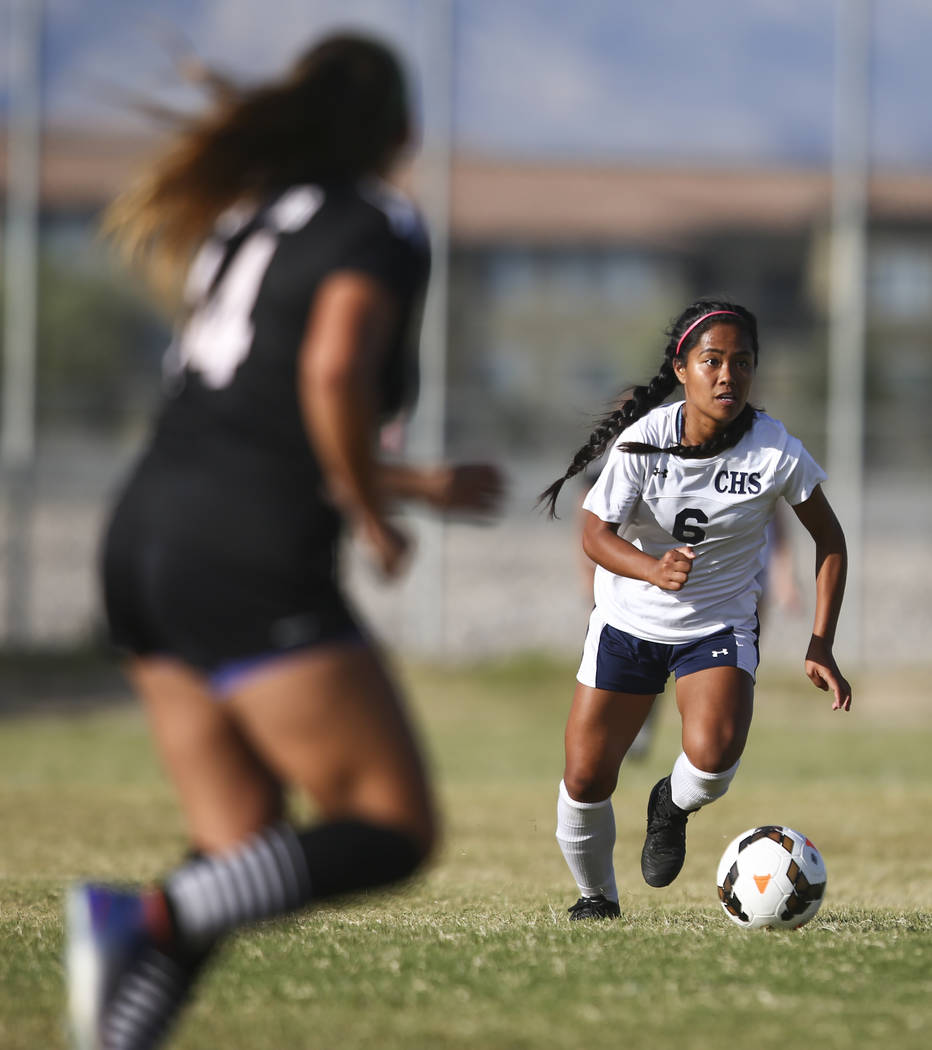 Centennial’s Dona Acierto (6) moves the ball up the field against Palo Verde during a ...