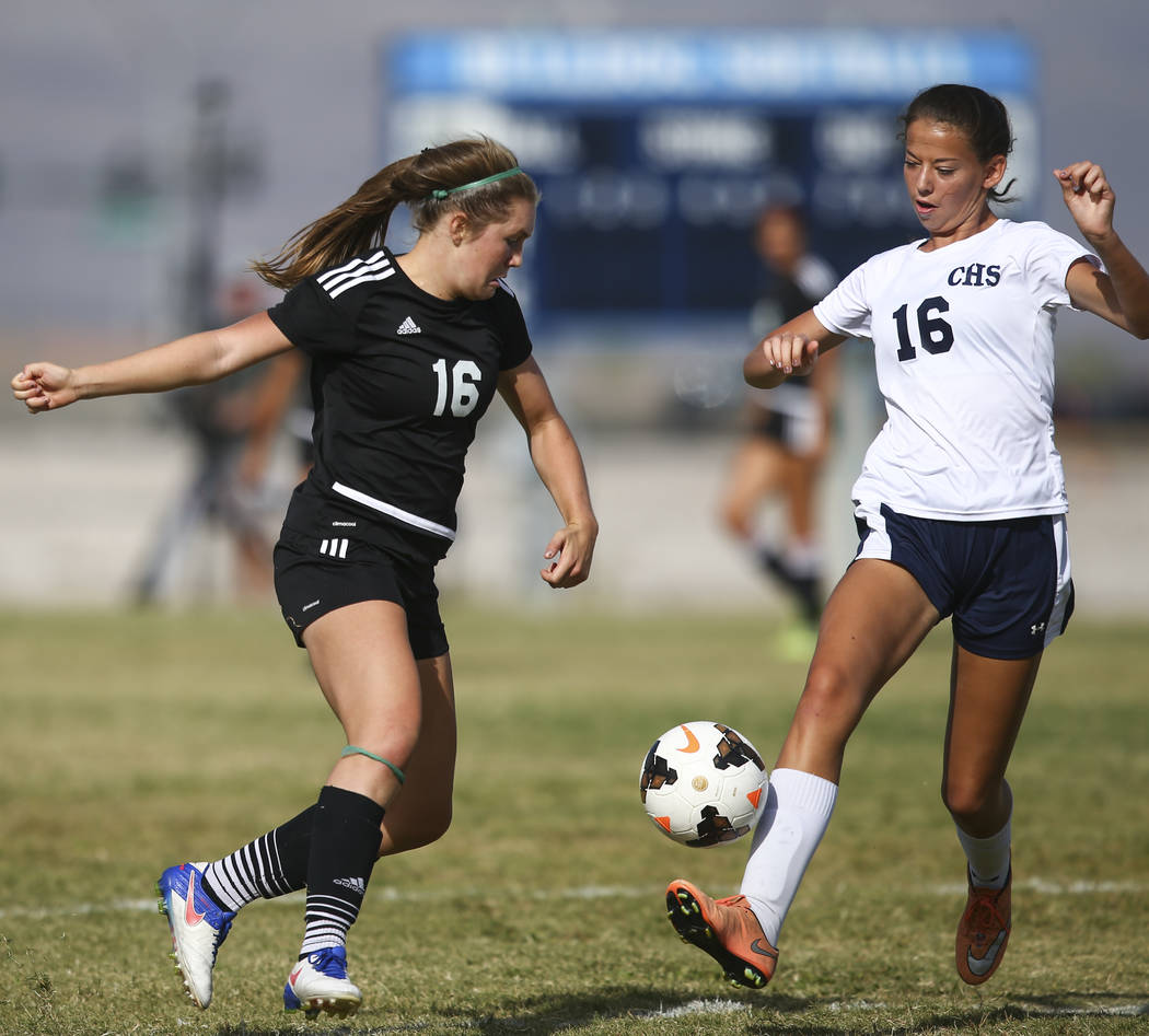 Palo Verde’s Olivia Packer, left, tries to get control of the ball over Centennial&#82 ...