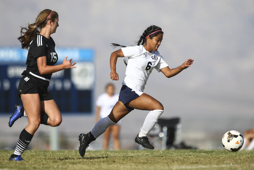 Centennial’s Dona Acierto (6) runs after the ball past Palo Verde’s Kassidy Sayl ...