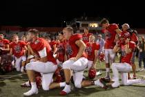 Arbor View take a knee after their 27-24 win over Faith Lutheran at Arbor View High School o ...