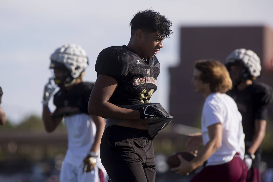 Faith Lutheran football player Ma’a Gaoteote takes a break after a drill during a prac ...
