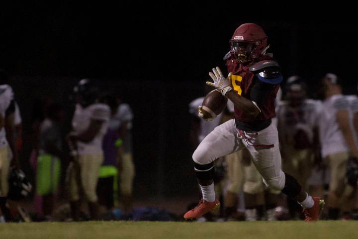 Del Sol senior Taariq Flowers runs the ball during a three-team scrimmage at Del Sol High Sc ...