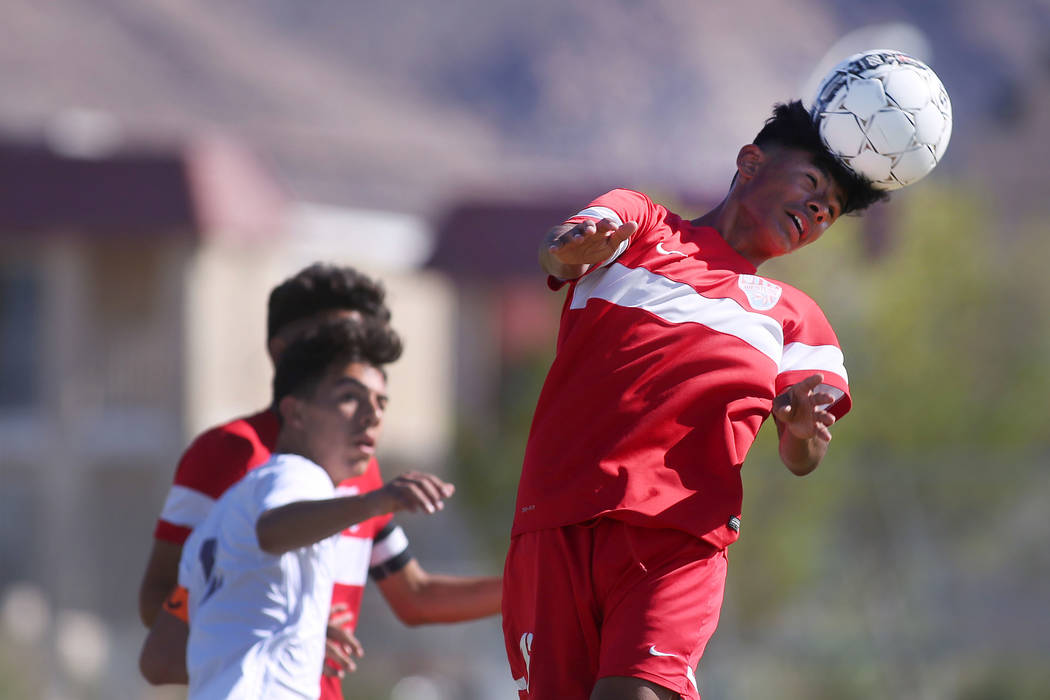 Western player Mauricio Muniz (16) heads the ball at during a game against Sunrise Mountain ...