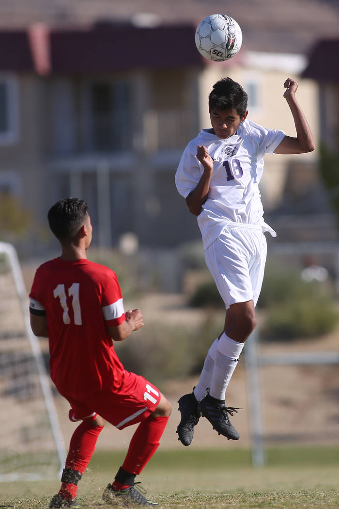Sunrise Mountain player Johnny Pedraza (18) heads the ball during a game against Western at ...