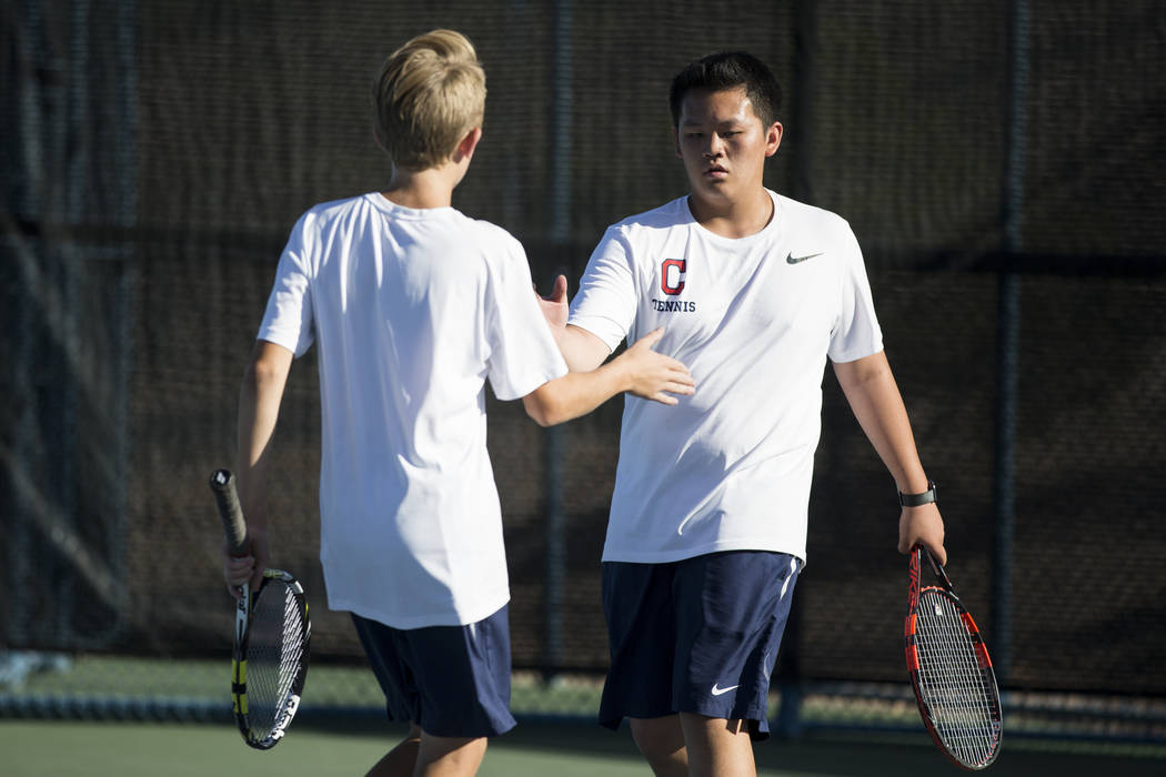 Coronado’s Jonah Blake, left, and Thomas Nguyen during their doubles match at the Darl ...