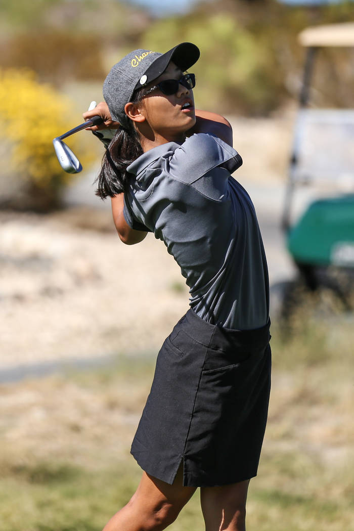 Clark’s Riana Mission swings during the Class 4A Sunrise and Sunset Region girls golf ...