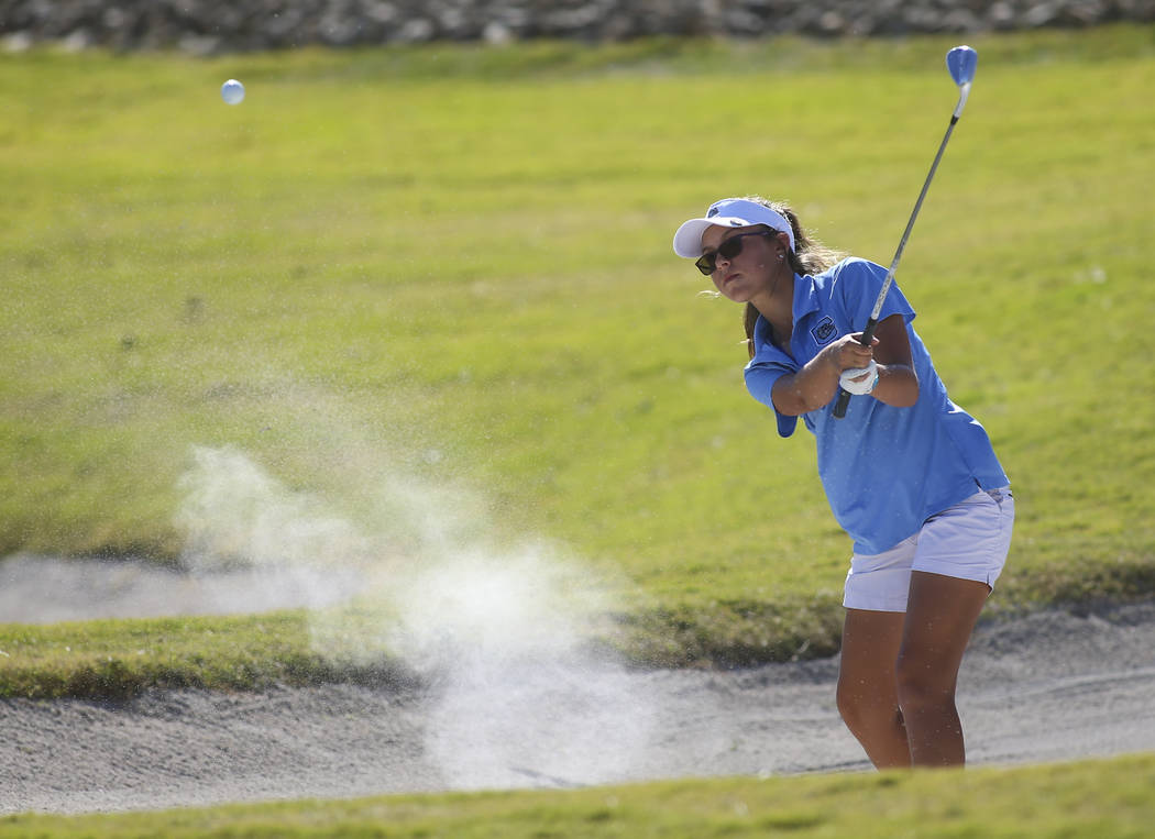 Centennial’s McKenzi Hall hits out of the bunker during the Class 4A state girls golf ...