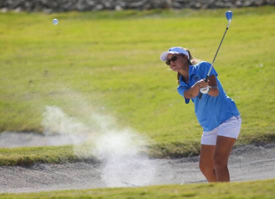Centennial’s McKenzi Hall hits out of the bunker during the Class 4A state girls golf ...