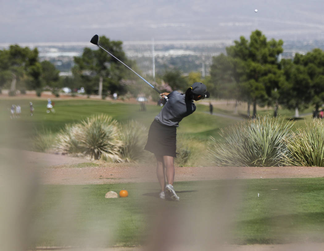 Clark’s Riana Mission watches her tee shot during the Class 4A state girls golf tourna ...
