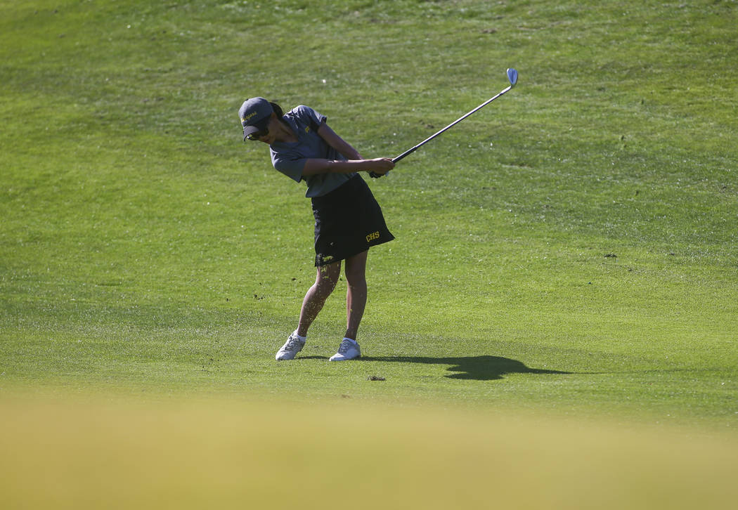 Clark’s Riana Mission swings during the Class 4A state girls golf tournament at Highla ...