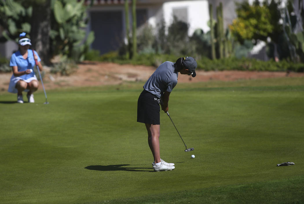Clark’s Riana Mission putts during the Class 4A state girls golf tournament at Highlan ...