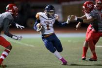 Legacy’s Aubrey Washington (1) runs the ball against Arbor View in the football game a ...