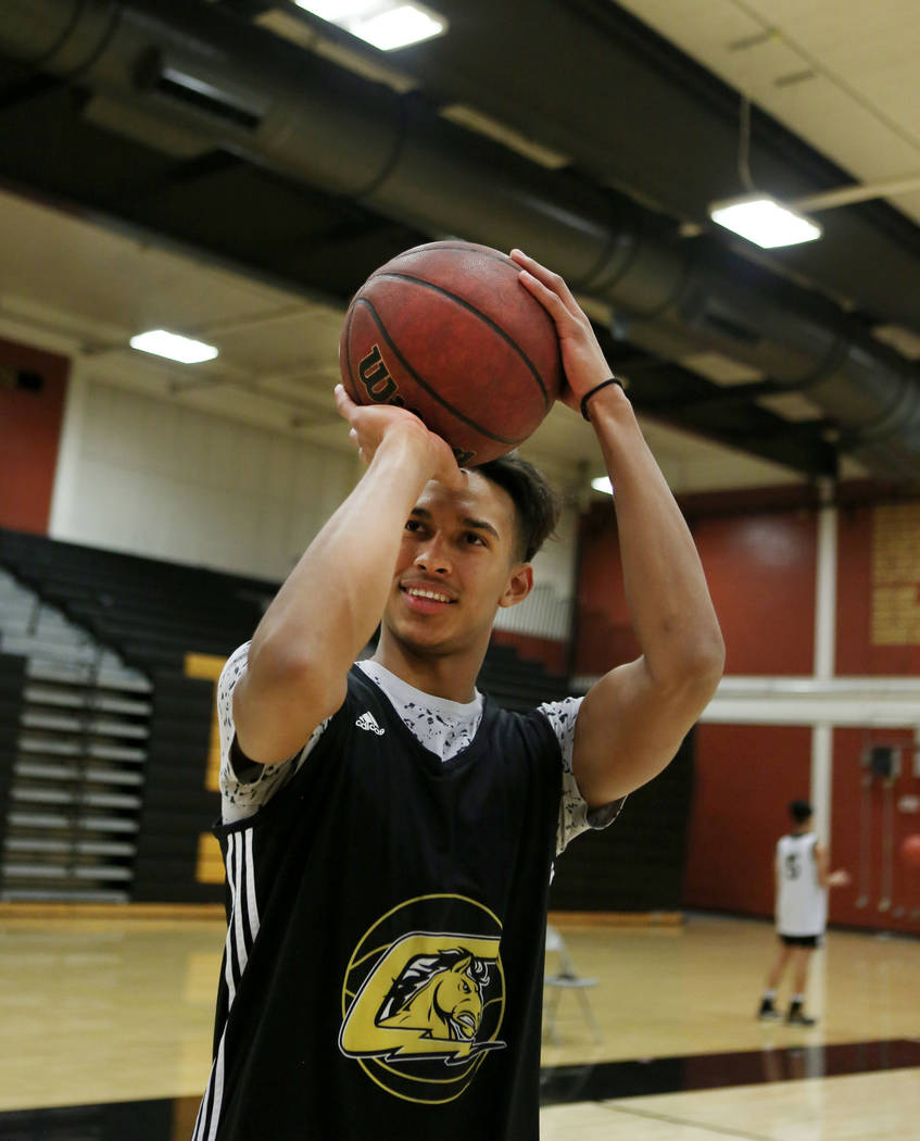 Clark High School senior Greg Foster shoots during basketball practice at Clark High School ...