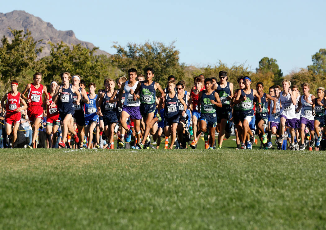 Runners compete during the Boys Cross Country Class 4A Sunrise Region race in Boulder City, ...