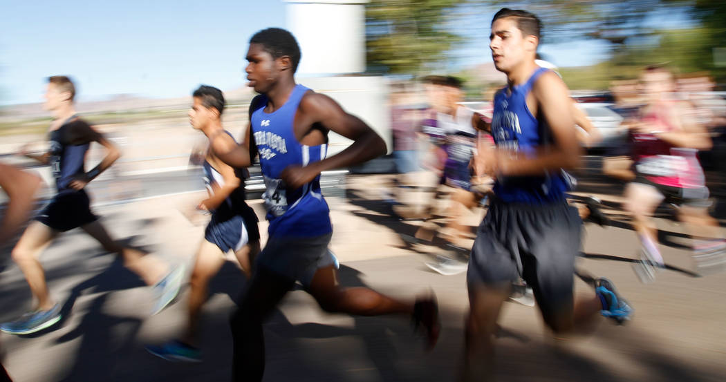 Runners compete during the Boys Cross Country Class 4A Sunset Region race in Boulder City, F ...