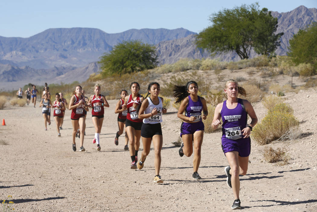 Runners compete during the Girls Cross Country Class 4A Sunset Region race in Boulder City, ...