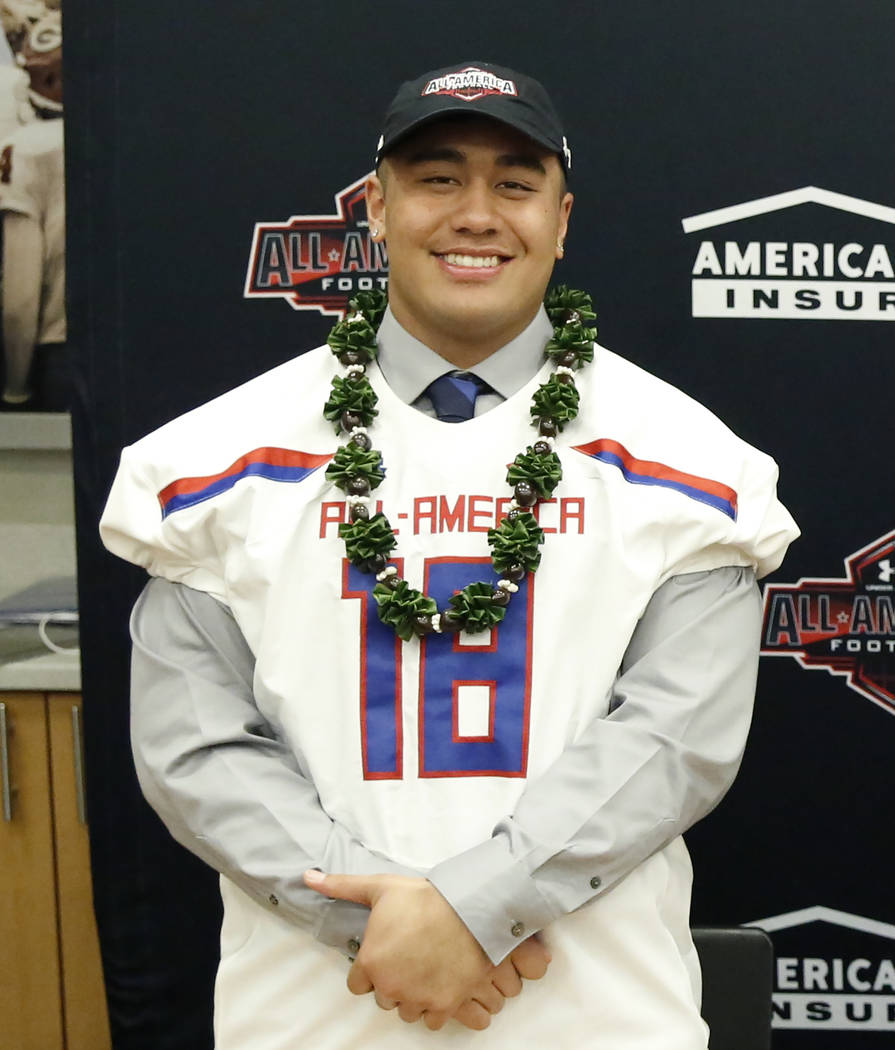 Bishop Gorman’s offensive guard Jacob Isaia receives his honorary All America Game jer ...