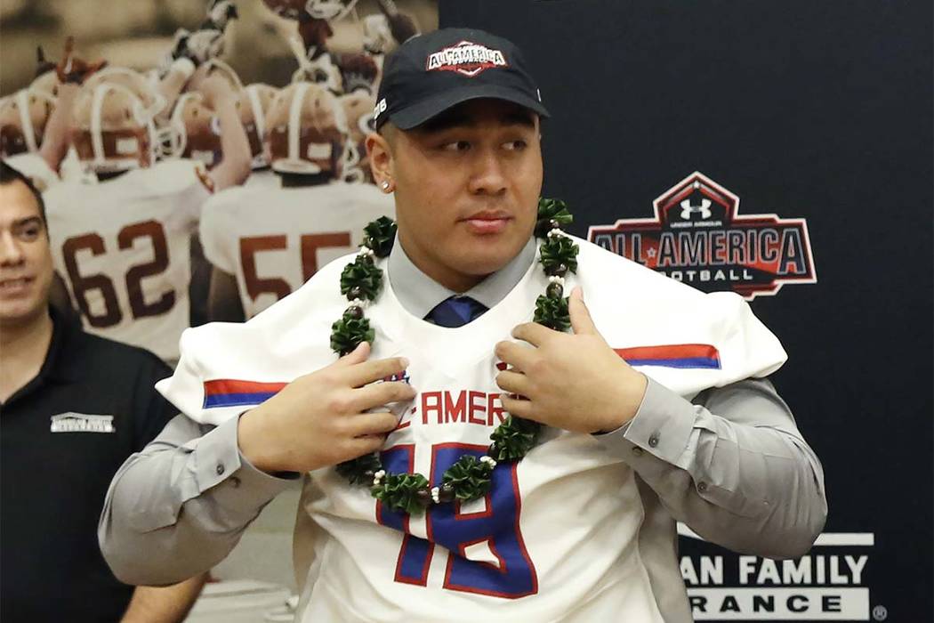 Bishop Gorman’s offensive guard Jacob Isaia receives his honorary All America Game je ...