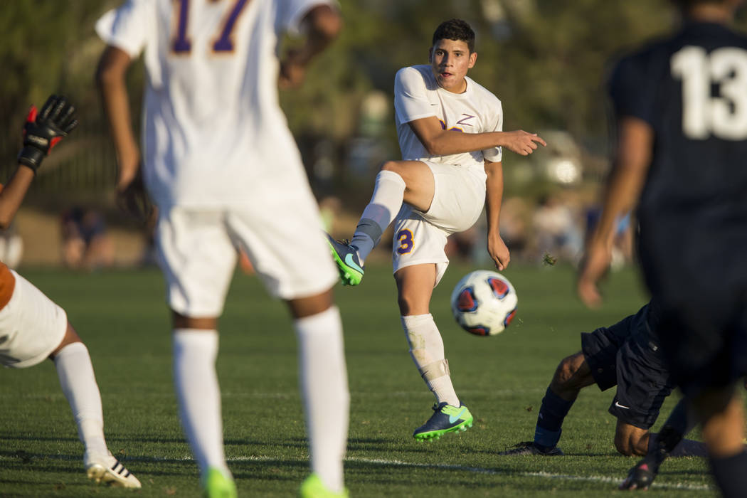 Durango’s Alfredo Robles Rodriguez (23) kicks the ball to the goal in the playoff socc ...