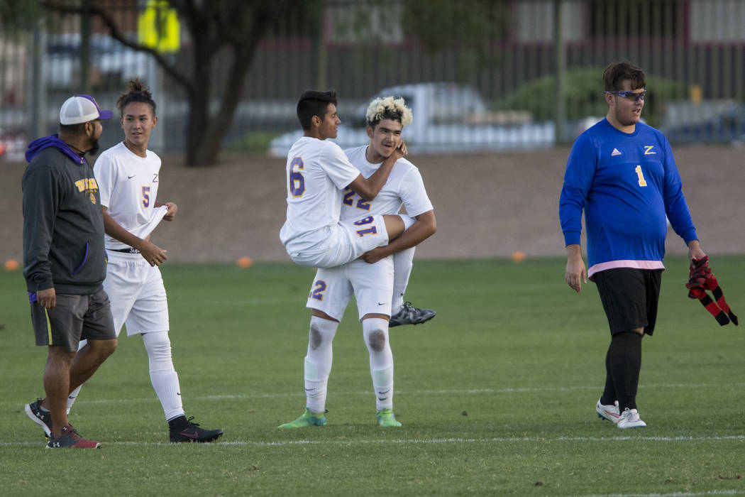 Durango’s Marlo Contreras (16) and Cristian De Leon Morales (22) celebrate their victo ...