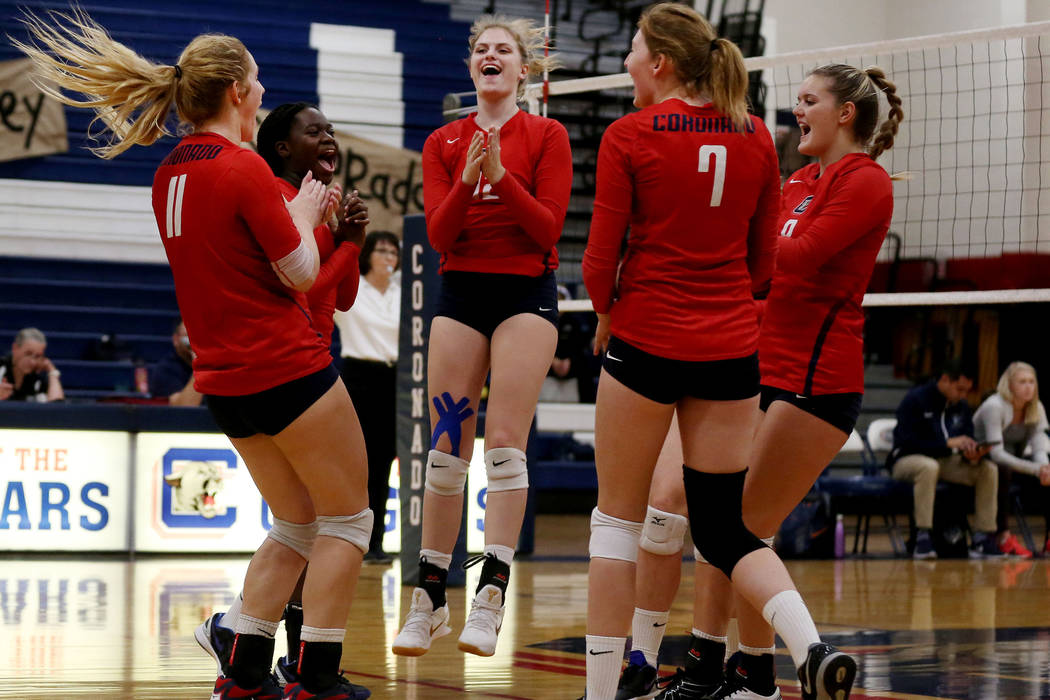Coronado teammates celebrate after scoring a point against Foothill during the Class 4A Sunr ...