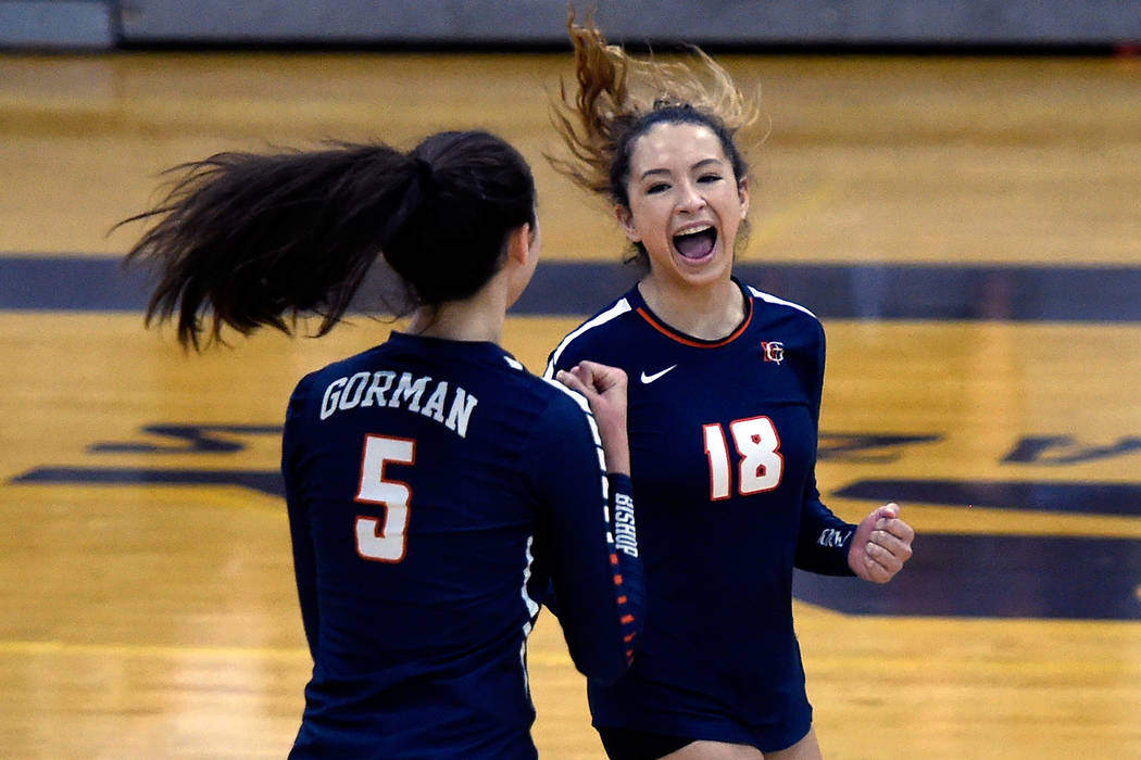 Bishop Gorman’s Sydney Lobato (5) and Sarah Lychock react after a point against Shadow ...