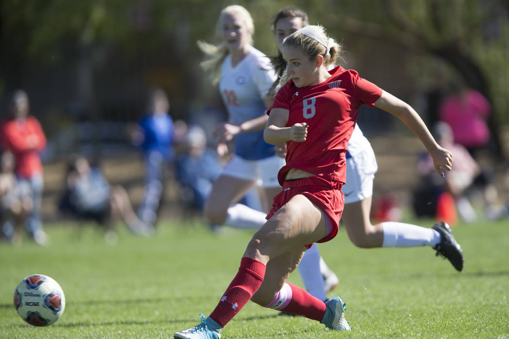 Arbor View’s Hannah Ferrara (8) kicks a ball to the goal against Bishop Gorman in the ...