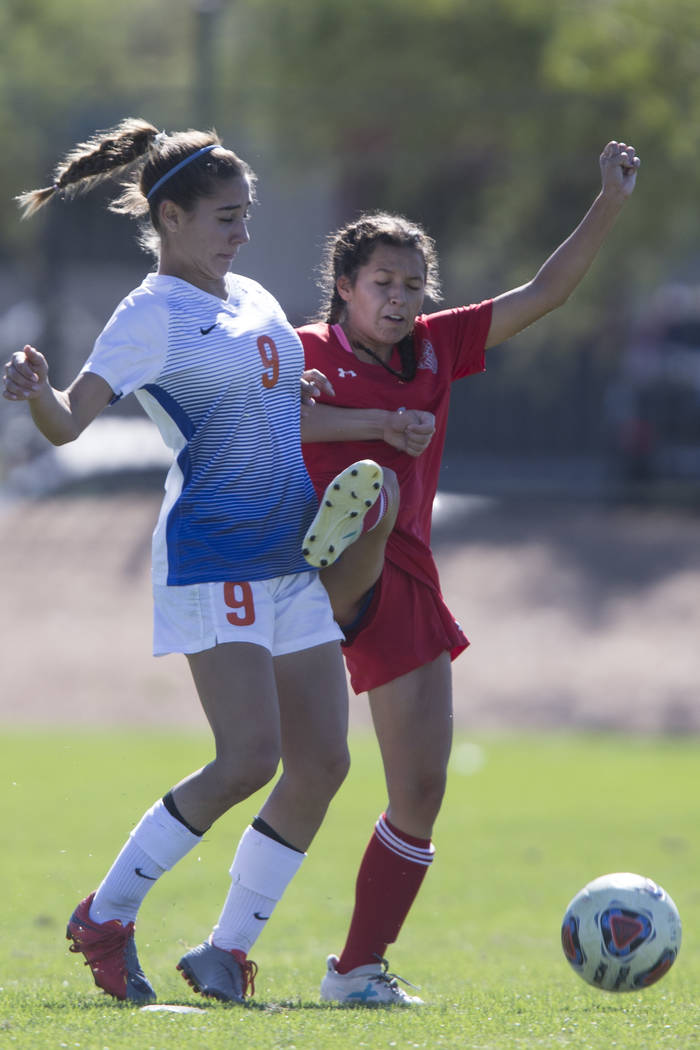 Bishop Gorman’s Jaden Terrana (9) fights for the ball against Arbor View’s Sierr ...