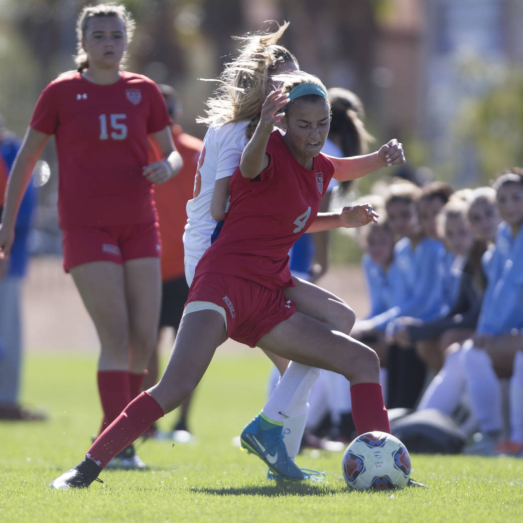 Arbor View’s Neally Peters (4) fights for the ball against Bishop Gorman’s Jacqu ...