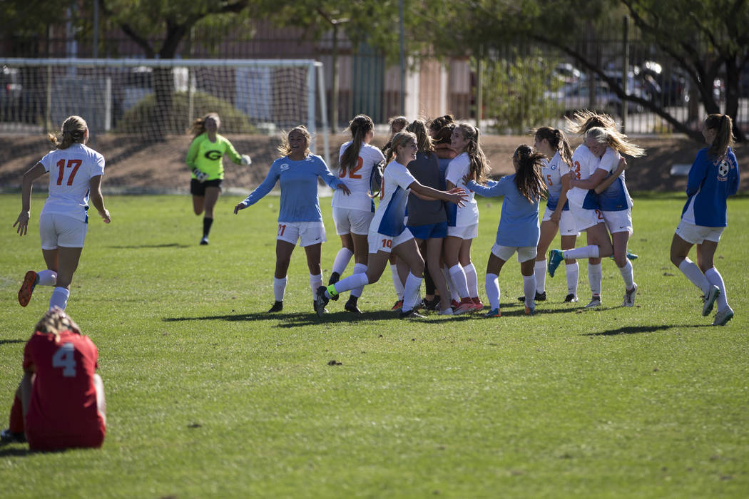 Bishop Gorman players celebrate their victory against Arbor View in the Sunset Region girl&# ...