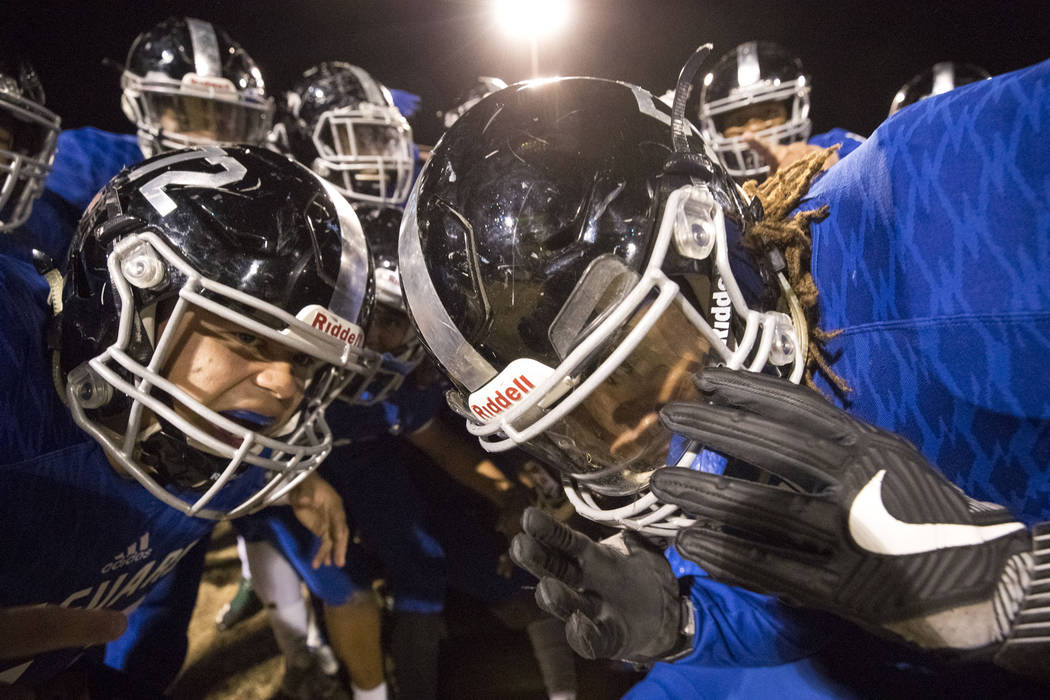 Desert Pines players celebrate their 48-0 victory over Sunrise Mountain High School followin ...