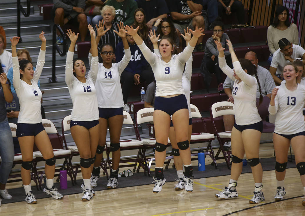 Shadow Ridge players celebrate while playing Coronado during the Class 4A state volleyball g ...