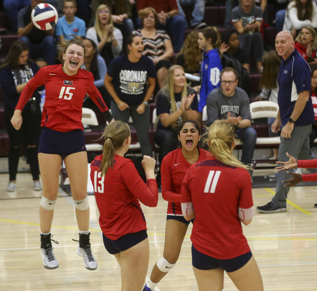 Coronado players celebrate while playing Shadow Ridge during the Class 4A state volleyball g ...