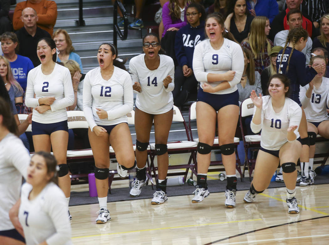 Shadow Ridge players celebrate while playing Coronado during the Class 4A state volleyball g ...