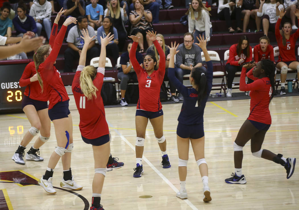 Coronado players celebrate while playing Shadow Ridge during the Class 4A state volleyball g ...