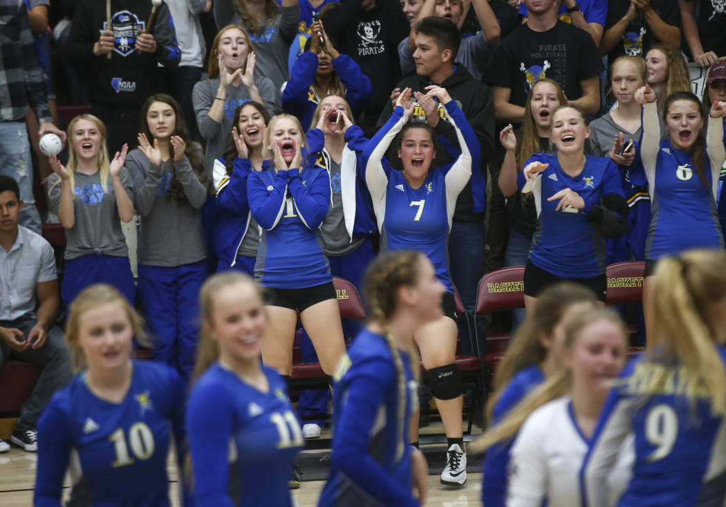 Moapa Valley players celebrate while playing Lowry during the Class 3A state volleyball game ...