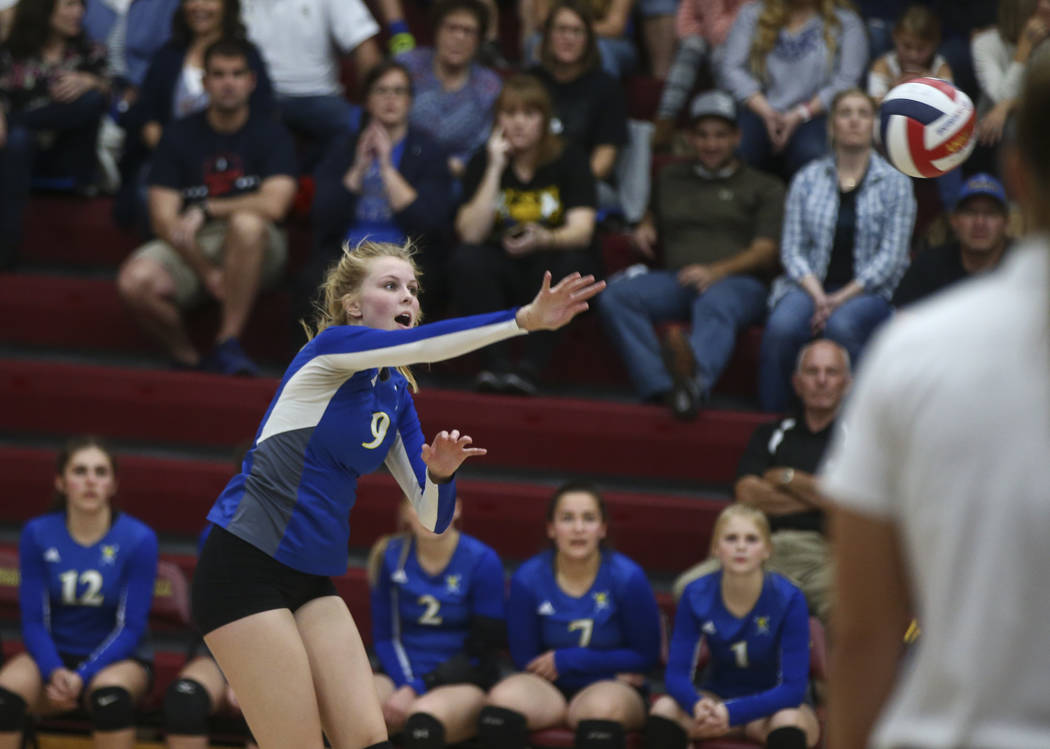 Moapa Valley’s Eden Whitmore (9) sends the ball to Lowry during the Class 3A state vol ...