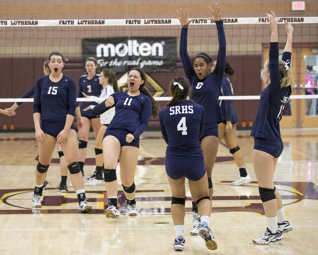 Shadow Ridge’s Kahea Nihipali (11) and teammates celebrate after Nihipali blocked the ...