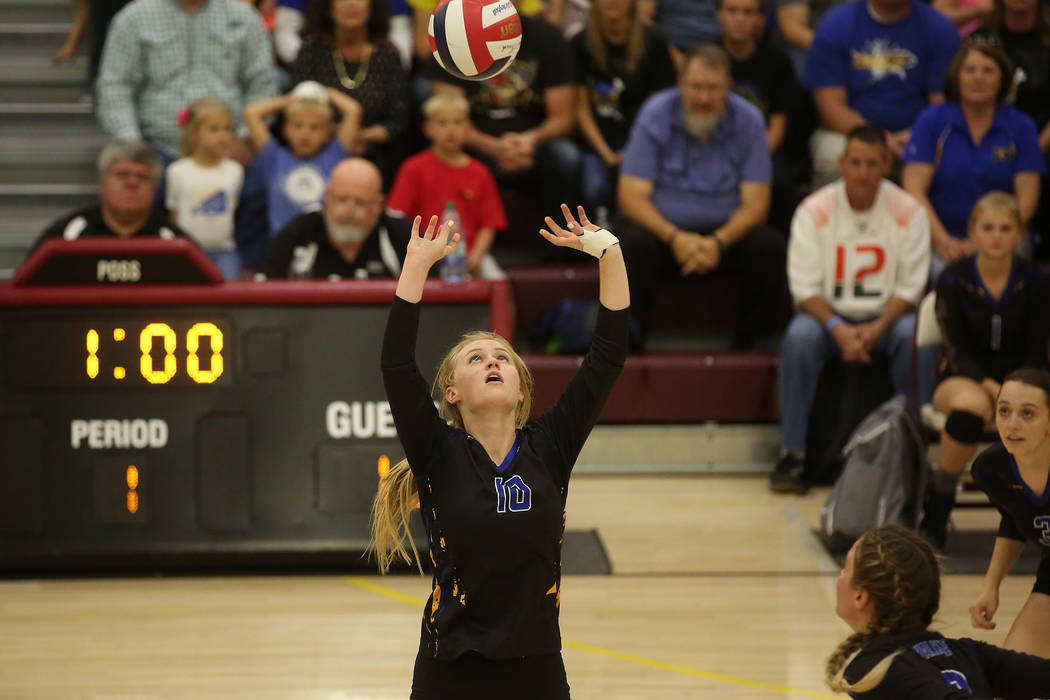 Moapa Valley player Aria Messer sets the ball during the class 3A state volleyball champion ...