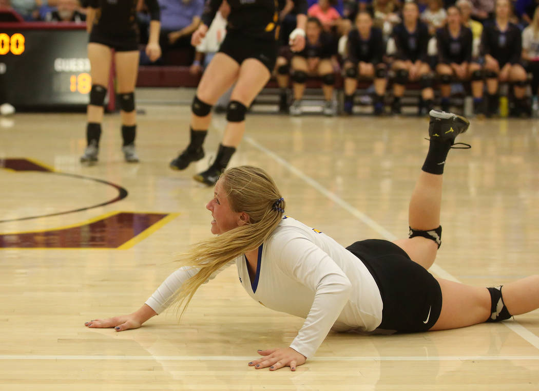 Moapa Valley player Kessa Evans attempts to dive for the ball during the class 3A state voll ...