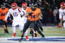 Bishop Gorman’s Dorian Thompson-Robinson (14) runs the ball against Arbor View during ...