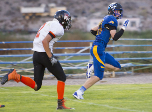 Pahranagat Valley Panthers tight end Culen Highbe, right, runs the ball for a touchdown agai ...