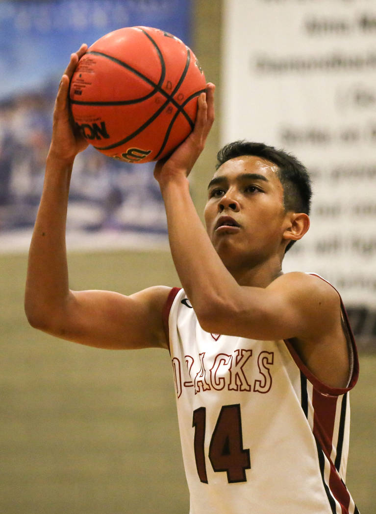 Desert OasisՠNate Van (14) shoots a free-throw during the second quarter of basketball ...