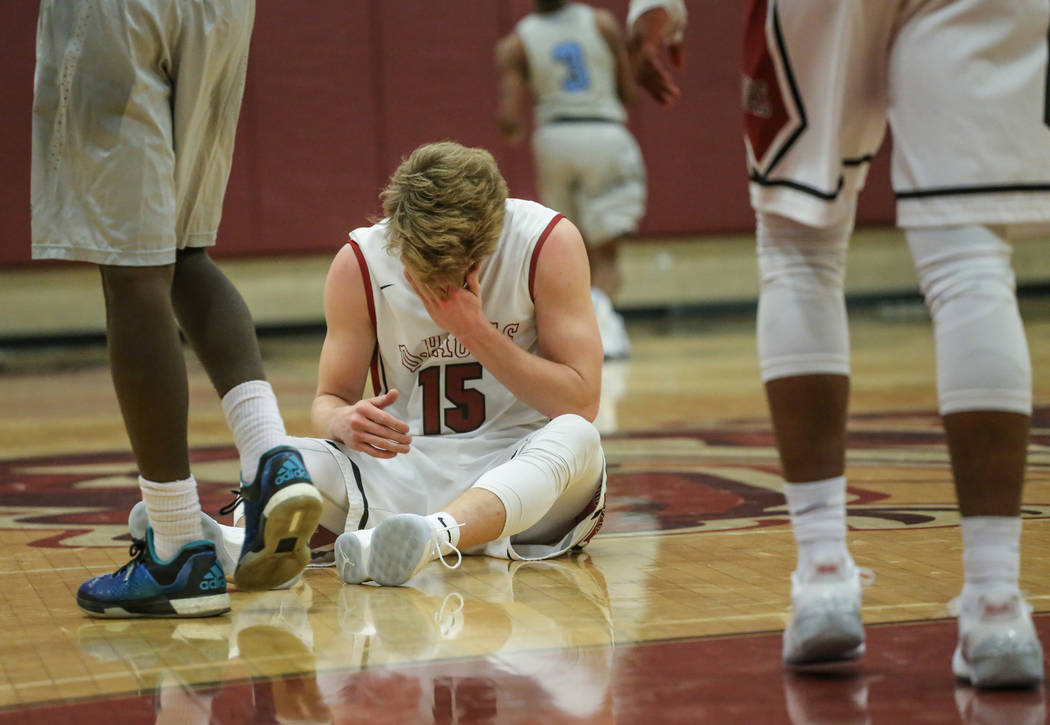 Desert OasisՠJacob Heese (15) rubs his forehead after a foul during the fourth quarter ...